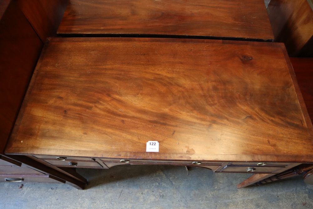 A George III mahogany dressing table, with crossbanded and five small drawers, width 107cm